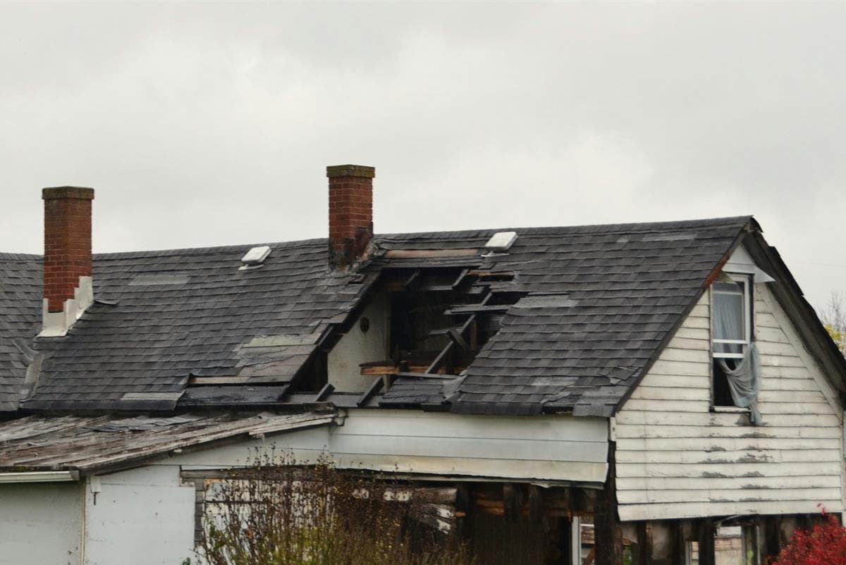 Loss photo: house with a hole torn through the roof